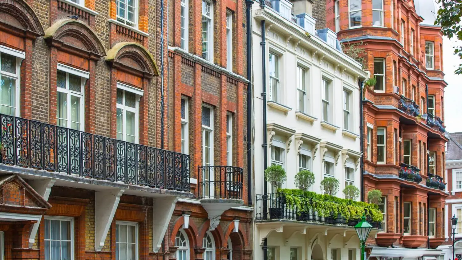 London terraced houses with brick and stucco frontages