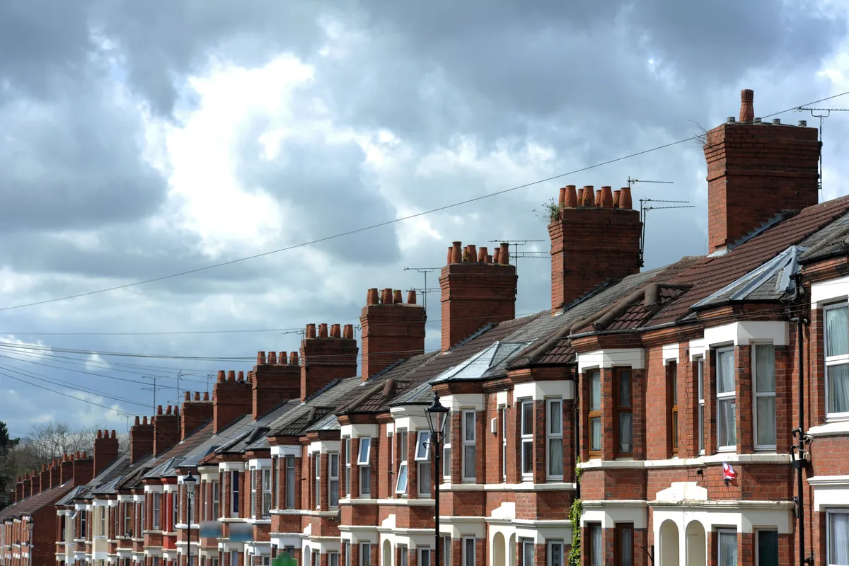 Chimney stacks along a terrace of West London houses