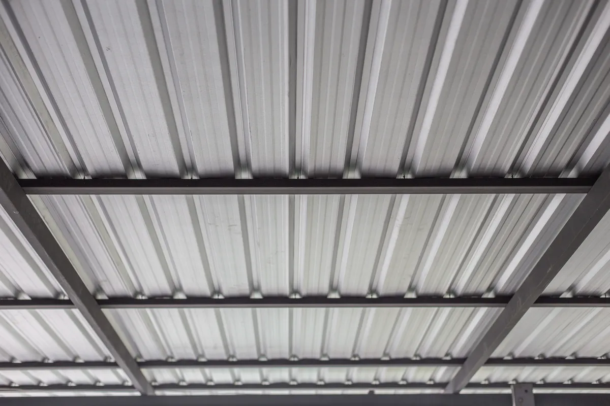 The underside of a profiled metal roof deck