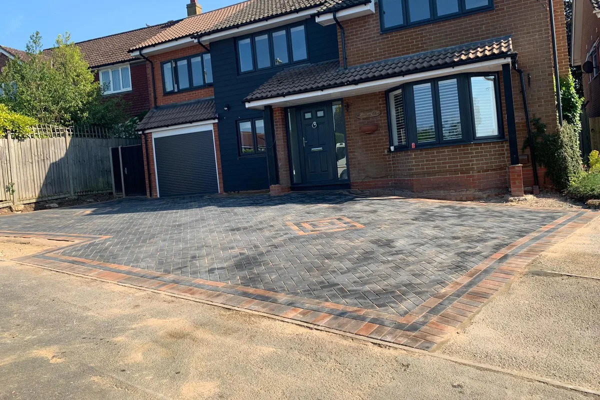 A block paved driveway with a circular feature laid to a West London house