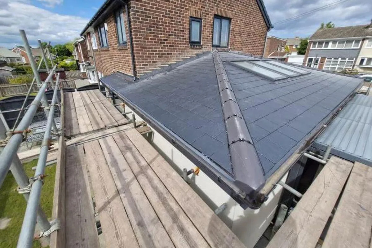 A dry ridge and dry verge finished on a rebuilt roof