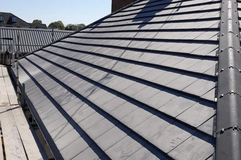 A slate roof with the hip and ridge lines dry fixed