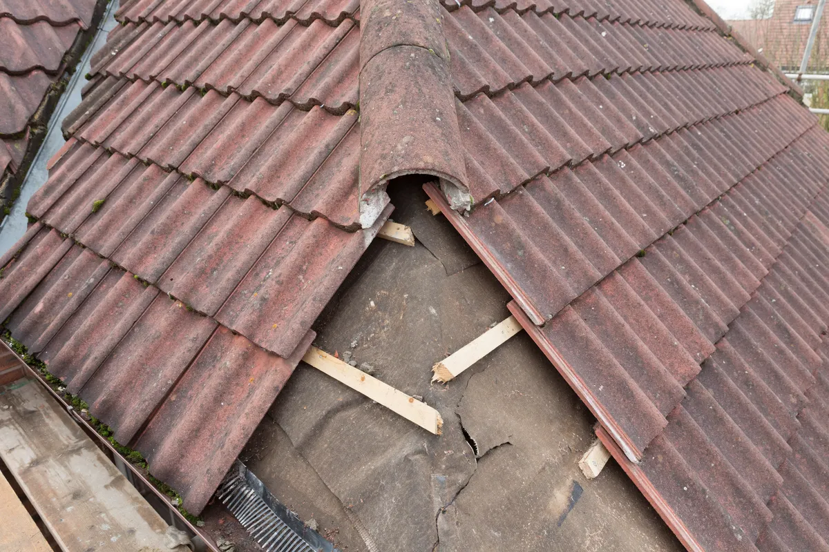 Slipped and broken tiles on a pitched roof