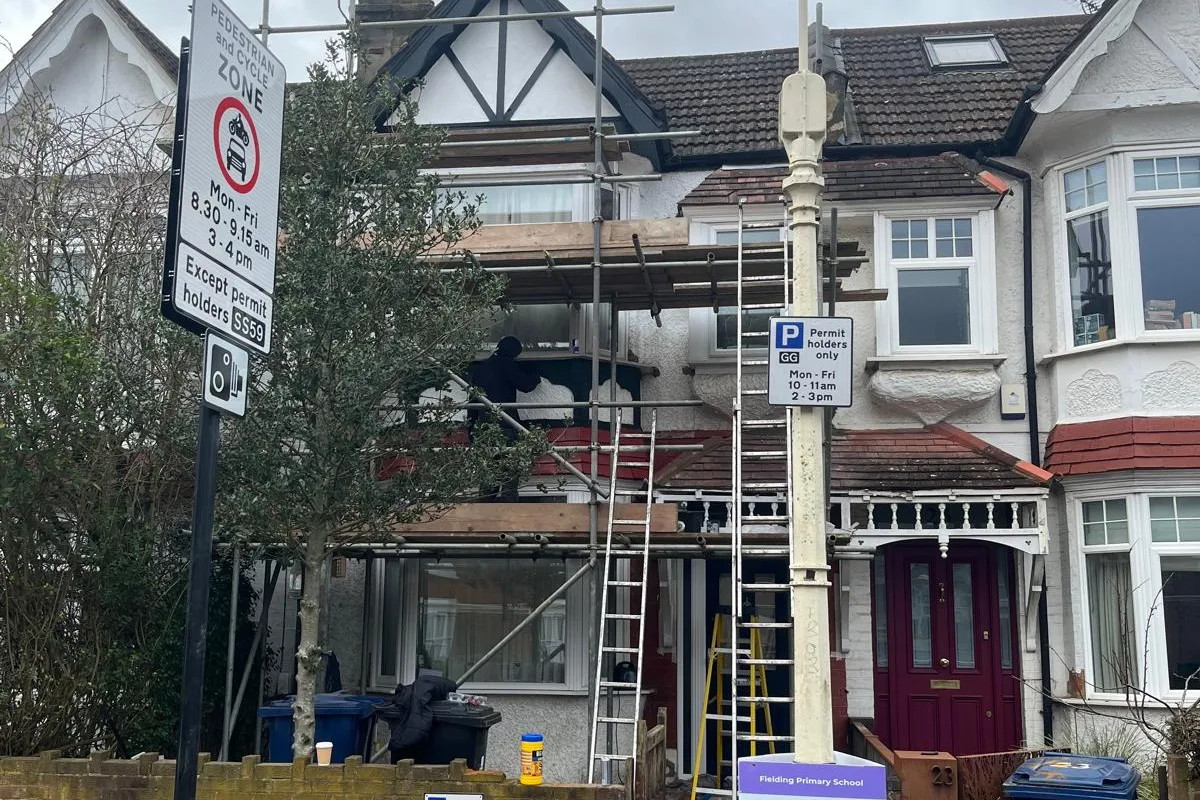 A West London terrace under TJM scaffold during building work
