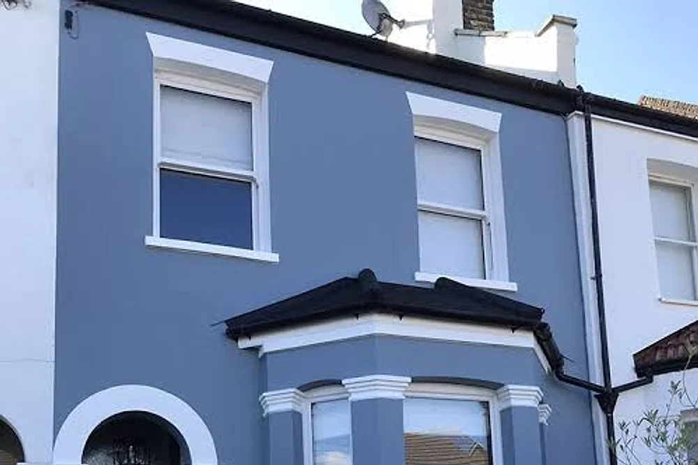 A rendered terrace repainted in blue with white bay and reveals